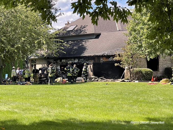 Damage visible near the garage at the front of a house that was engulfed with flames when firefighters arrived on McGlashen Drive in South Barrington (PHOTO CREDIT: Jimmy Bolf)