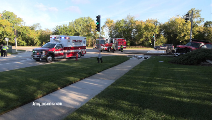 Palatine Fire Department paramedics preparing to transport a crash victim to Northwest Community Hospital after a crash involving a landscaping truck and an SUV also injured a bicyclist