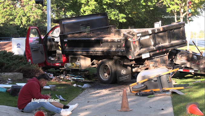 A landscaping truck was forced off of Lake Cook Road from the impact of a crash with a small SUV at the intersection of Lake Cook Road and Wilke Road Thursday morning, September 29, 2022.