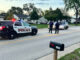 Victim’s vehicle In street during police investigation on Rohlwing Road north of Campbell Street in Rolling Meadows Wednesday morning, September 21, 2022