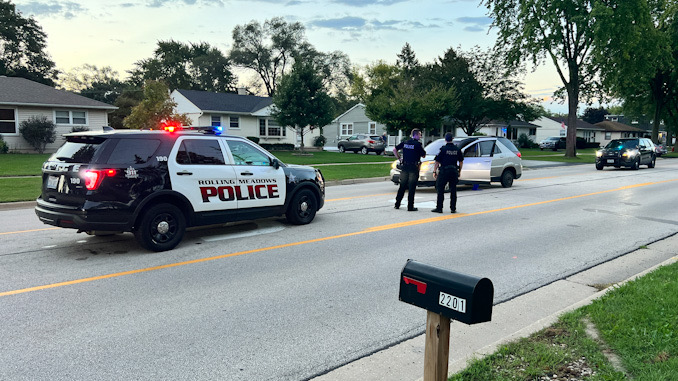 Victim’s vehicle In street during police investigation on Rohlwing Road north of Campbell Street in Rolling Meadows Wednesday morning, September 21, 2022