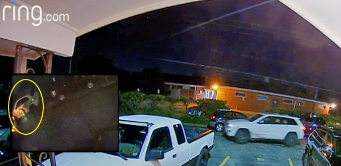 Catalytic converter theft captured on ring camera about 1:00 am. Thursday, September 1, 2022/Inset shows victim's vehicle with hooded suspected with flashlight (SOURCE: user upload on ring)