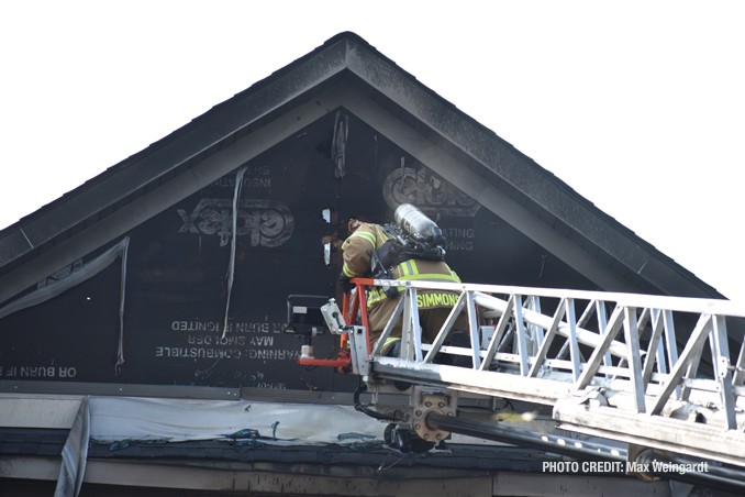 Ladder truck at the roof gable at attached garage fire on Hidden Creek Road in Lake Zurich, Wednesday, September 14, 2022 (PHOTO CREDIT: Max Weingardt)