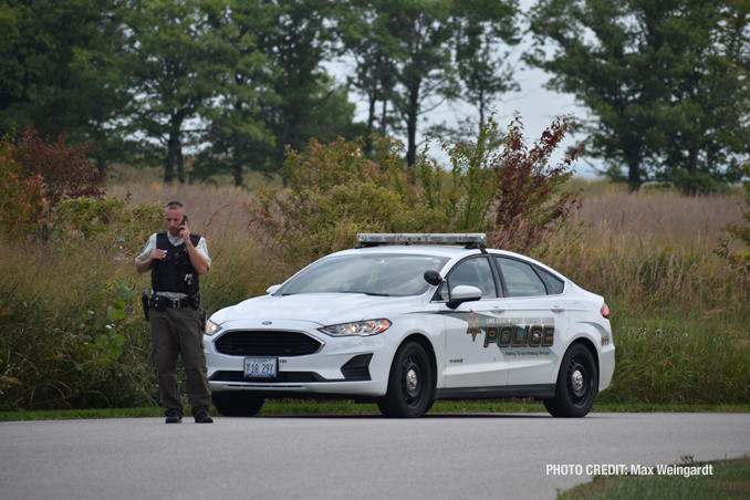 Lake County Forest Preserve Police at the scene where a body was found near the Lake Michigan shoreline near the Fort Sheridan Forest Preserve (PHOTO CREDIT: Max Weingardt).