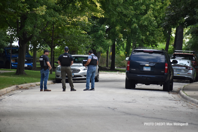 Police meet at the scene where a body was found near the Lake Michigan shoreline near the Fort Sheridan Forest Preserve (PHOTO CREDIT: Max Weingardt)