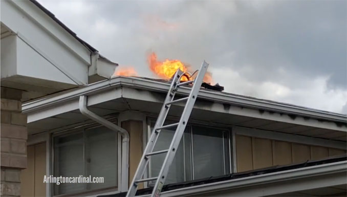 Fire through the roof at house fire on Mount Prospect Road south of Golf Road