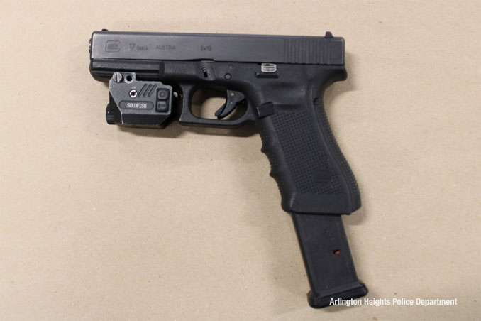 Glock model 17, 9mm with extended magazine and laser sights found in the rear seat (SOURCE: Arlington Heights Police Department)