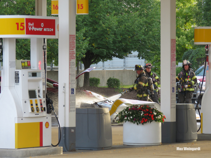 A vehicle fire involving a red Hyundai was extinguished quickly by Highland Park firefighters after the driver hit an island bollard and a gas pump at the Shell gas station at Skokie Boulevard and Lake Cook Road in Highland Park (PHOTO CREDIT: Max Weingardt)