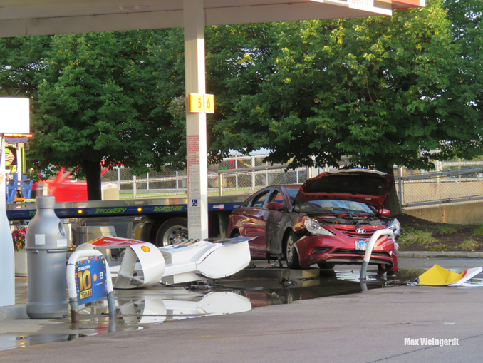 A vehicle fire involving a red Hyundai was extinguished quickly by Highland Park firefighters after the driver hit an island bollard and a gas pump at the Shell gas station at Skokie Boulevard and Lake Cook Road in Highland Park (PHOTO CREDIT: Max Weingardt)