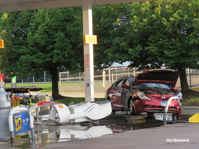 A vehicle fire involving a red Hyundai was extinguished quickly by Highland Park firefighters after the driver hit an island bollard and a gas pump at the Shell gas station at Skokie Boulevard and Lake Cook Road in Highland Park (PHOTO CREDIT: Max Weingardt)