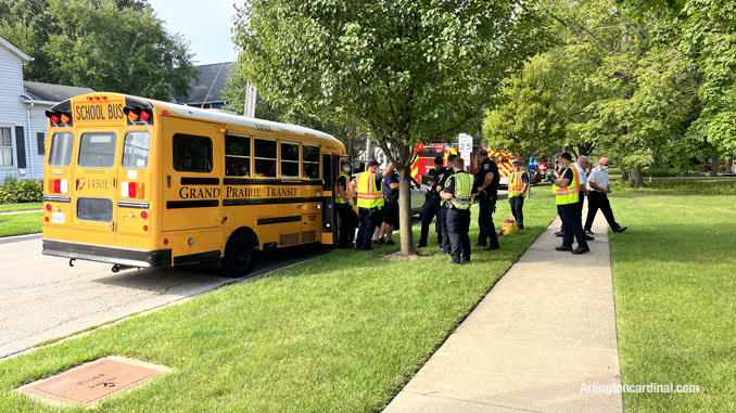 Police and paramedics documenting the crash while some firefighters handed out stickers for the children in the bus.