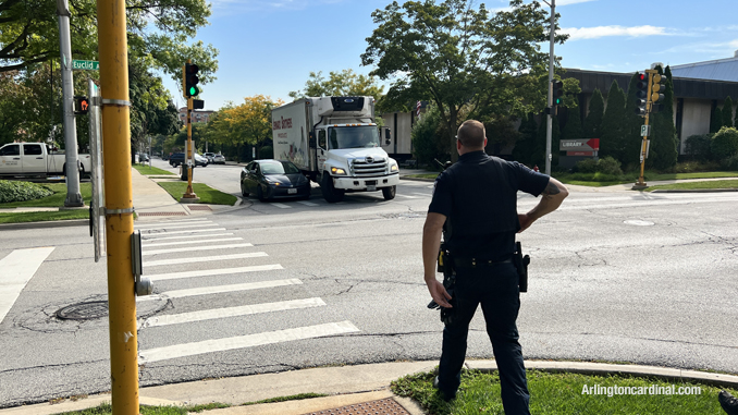 Police move up toward the truck and car where a crash almost occurred near the scene of the first crash at Dunton Avenue and Euclid Avenue in Arlington Heights