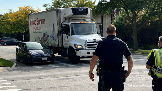 Police move up toward the truck and car where a crash almost occurred near the scene of the first crash at Dunton Avenue and Euclid Avenue in Arlington Heights.