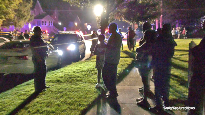 Crowd near the scene of a fatal police officer-involved shooting in Zion, Illinois (PHOTO CREDIT: Craig/CapturedNews).
