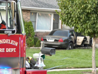 Mundelein Fire Department engine at the scene of a vehicle fire after a crash against a house on Quigley Street in Mundelein (Craig/CapturedNews)