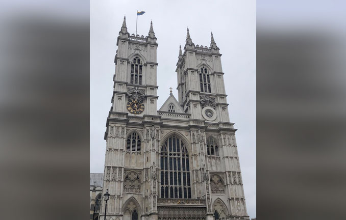 Westminster Abbey in 2021 (PHOTO CREDIT: Grace Wurgler, Creative Commons Attribution-Share Alike 4.0 International license/photo unmodified except with background for give horizontal dimension)