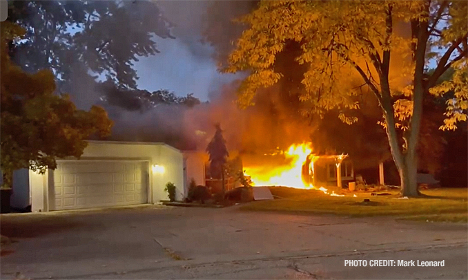 Flames from the front of a house "Side A" on Golf Road in Libertyville (PHOTO CREDIT: Mark Leonard)