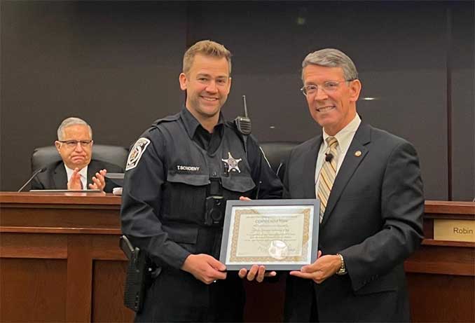 Police Officer Treston Schoeny (left) with Arlington Heights Mayor Tom Hayes (PHOTO CREDIT: Village of Arlington Heights)