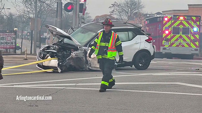 White Nissan towed off railroad tracks after extrication crash US-14 and Arlington Heights Road on Sunday, October 30, 2022