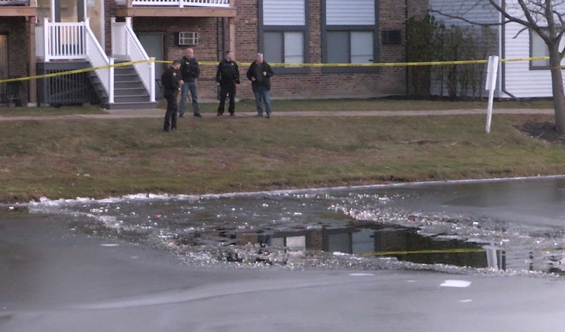 A hole in the ice were four young boys fell through into water at an apartment pond on Panorama Drive in Palatine (NorthShore Updates/CapturedNews)