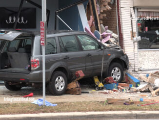 Gray Honda SUV after a double fatal crash over a sidewalk and against the walls of two buildings on Northwest Highway in Des Plaines on Sunday, November 27, 2022