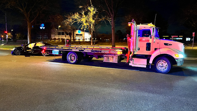 Hillside Towing clearing a wrecked black Lexus from westbound Palatine Road west of Rand Road in Arlington Heights