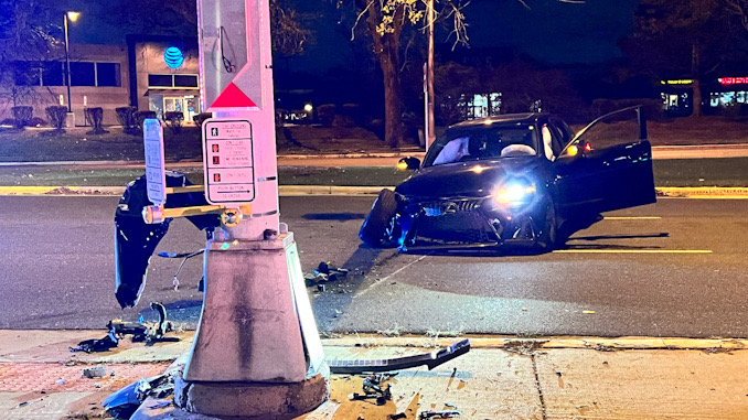 Black Lexus sedan with severe right, front damage after a crash with a traffic signal standard at Palatine Road and Rand Road in Arlington Heights