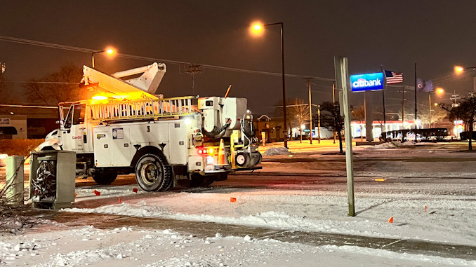 ComEd crew on the scene of a down power line, a primaryi line from pole to pole on Dundee Road near Golfview Terrace.