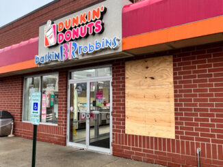 Dunkin' Donuts with a broken window after an overnight storefront burglary, Wednesday, December 14, 2022