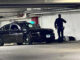 Police helping a man down in the underground parking garage under Arlington Town Square in the block of 0-99 South Evergreen Avenue in Arlington Heights on Sunday, December 4, 2022