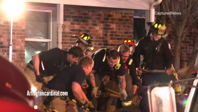 Firefighters rapidly, digging with hand shovels for a technical rescue below grade in the block of 1000 Aspen Drive in Buffalo Grove on Monday, December 12, 2022.