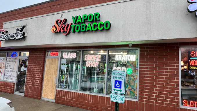 Sky Vapor Tobacco with a glass door damaged after an overnight burglary Wednesday, December 14, 2022.