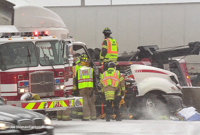 Firefighters and paramedics working to extrication at truck driver after a crash on I-94 EAST near Gurnee on Thursday, December 22, 2022 during a winter storm (PHOTO CREDIT: Joe Shuman/CapturedNews)