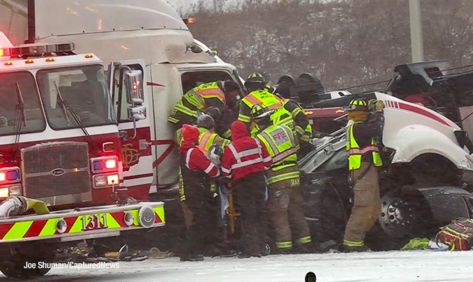 Firefighters and paramedics working to extrication at truck driver after a crash on I-94 EAST near Gurnee on Thursday, December 22, 2022 during a winter storm (PHOTO CREDIT: Joe Shuman/CapturedNews)