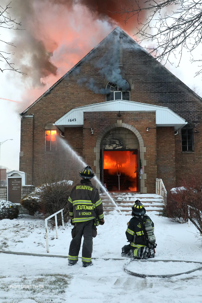 Fire visible through the front entrance at the former Rock of Ages Baptist Church building in Maywood at 1642 South 15th Avenue in Maywood on Monday, December 26, 2022 (PHOTO CREDIT: Tim Olk/Photo Unit)