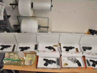 Seized firearms, cash and other items (SOURCE: Zion Police Department)
