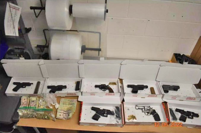 Seized firearms, cash and other items (SOURCE: Zion Police Department)