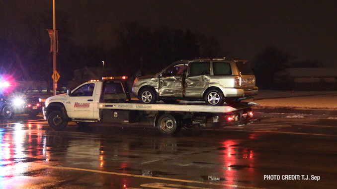 SUV with driver's side damage loaded up on a Hillside tow truck after a crash with a fire engine responding to an emergency call on Wednesday, January 25, 2023 (PHOTO CREDIT: T.J. Sep)