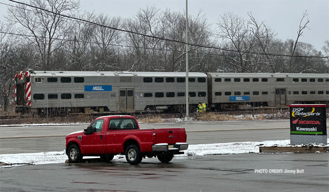Metra Train #712 at about 12:00 p.m. stopped on the UP Northwest Line just west of Ela Road after striking and killing a pedestrian (PHOTO CREDIT: Jimmy Bolf)