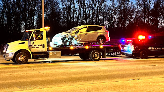 A car that hit a police SUV from Palatine and the police SUV are prepared for towing after a crash on Northwest Highway near Palatine Stables, 1510 West Northwest Highway.