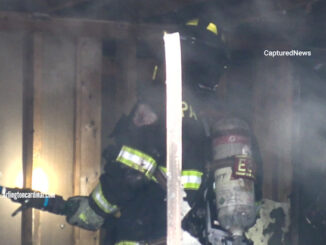 A firefighter with a hose line looks for hot spots about 20 to 30 minutes after a deadly condo unit fire was reported at 245 North Smith Street in Palatine on Saturday, February 4, 2023