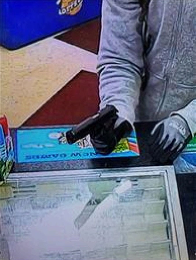 Armed robber's on security camera during Beach Park gas station armed robbery on Monday, February 20, 2023 (SOURCE: Lake County Sheriff's Office)