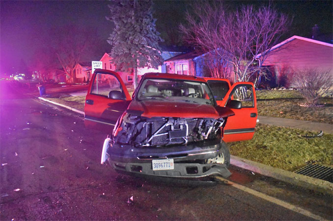 Red pickup truck that pulled in front of a Lake County Sheriff's Office SUV and crashed in Waukegan after driver of a pickup truck blew a stop sign on Sunday, February 26, 2023 (SOURCE: Lake County Sheriff's Office).