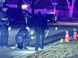 Hoffman Estates police officers collecting evidence on Flagstaff Lane between Olive Street and Grand Canyon Street in Hoffman Estates