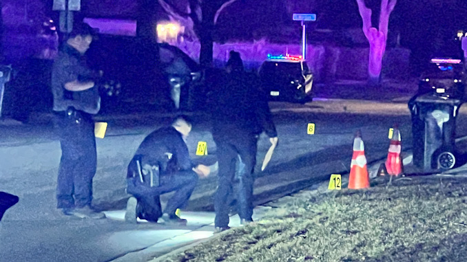 Hoffman Estates police officers collecting evidence on Flagstaff Lane between Olive Street and Grand Canyon Street in Hoffman Estates
