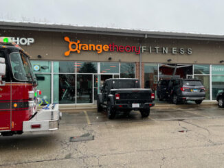Gray Honda Pilot driven into Orange Theory Fitness storefront on Milwaukee Avenue in Riverwoods, Sunday, March 12, 2023 (PHOTO CREDIT: NorthShore Updates)