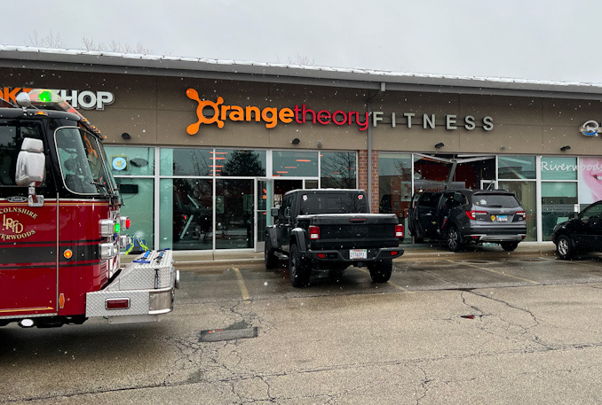 Gray Honda Pilot driven into Orange Theory Fitness storefront on Milwaukee Avenue in Riverwoods, Sunday, March 12, 2023 (PHOTO CREDIT: NorthShore Updates)