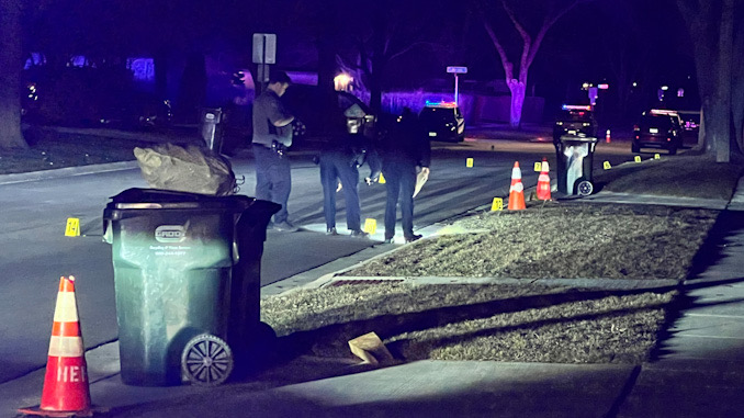 Hoffman Estates police officers collecting evidence on Flagstaff Lane between Olive Street and Grand Canyon Street in Hoffman Estates