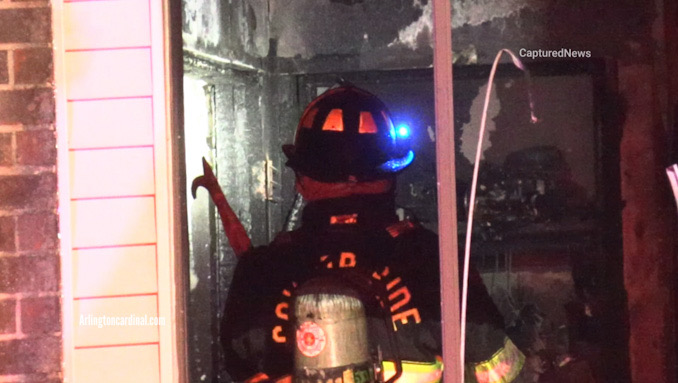 A Countryside firefighter pulling down ceiling from an apartment on the second floor on Court of Shorewood, Sunday, March 19, 2023 (CARDINAL NEWS)