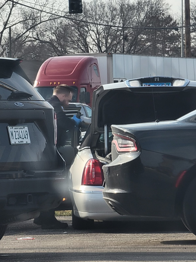 Palatine police investigated the scene where a homeless person was found dead in a silver Lincoln Town Car Thursday afternoon, March 23, 2023.